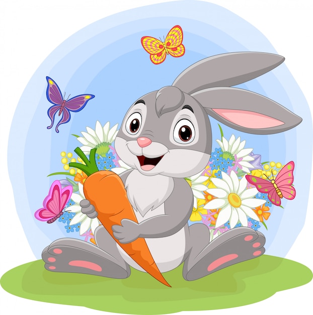 cartoon-rabbit-holding-a-carrot-in-the-grass_29190-5668.jpg